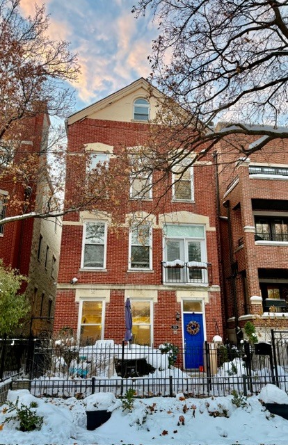 a front view of a building with street view