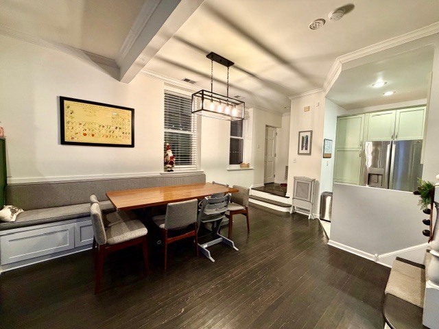Undisclosed Address Chicago, IL 60614 - Photo 3 of 18 a view of a dining room with furniture and wooden floor