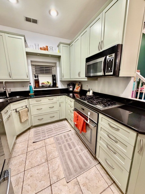 Undisclosed Address Chicago, IL 60614 - Photo 6 of 18 a kitchen with stainless steel appliances granite countertop a sink and cabinets