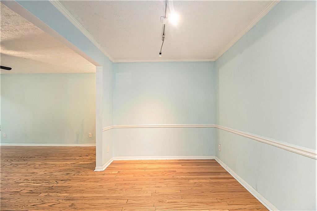5143 Roswell Road, Unit 8 Atlanta, GA 30342 - Photo 11 of 27 a view of an empty room with wooden floor