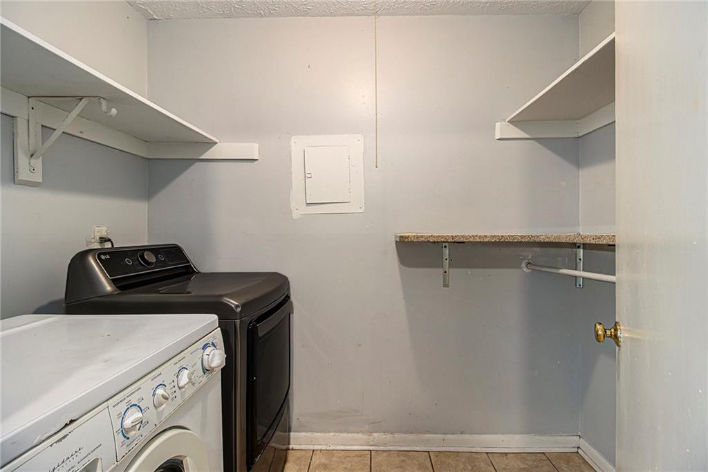 5143 Roswell Road, Unit 8 Atlanta, GA 30342 - Photo 17 of 27 a utility room with dryer and washer