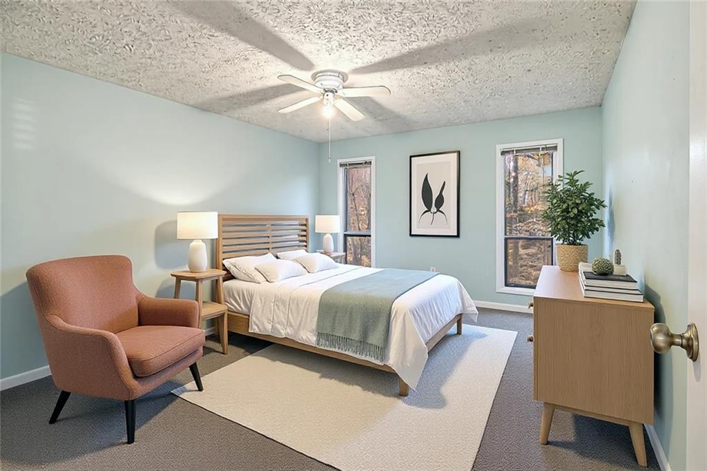 5143 Roswell Road, Unit 8 Atlanta, GA 30342 - Photo 21 of 27 a bedroom with a bed and a chair