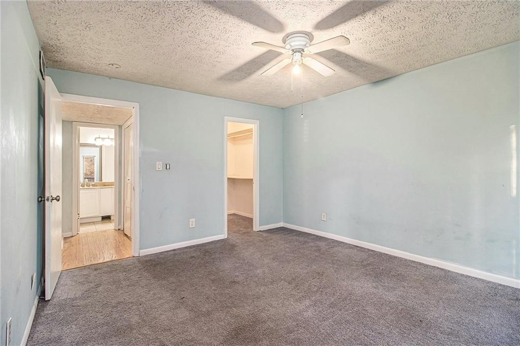 5143 Roswell Road, Unit 8 Atlanta, GA 30342 - Photo 23 of 27 an empty room with fan and fan