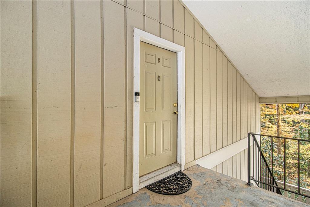 5143 Roswell Road, Unit 8 Atlanta, GA 30342 - Photo 3 of 27 a view of a hallway with wooden floor and entryway