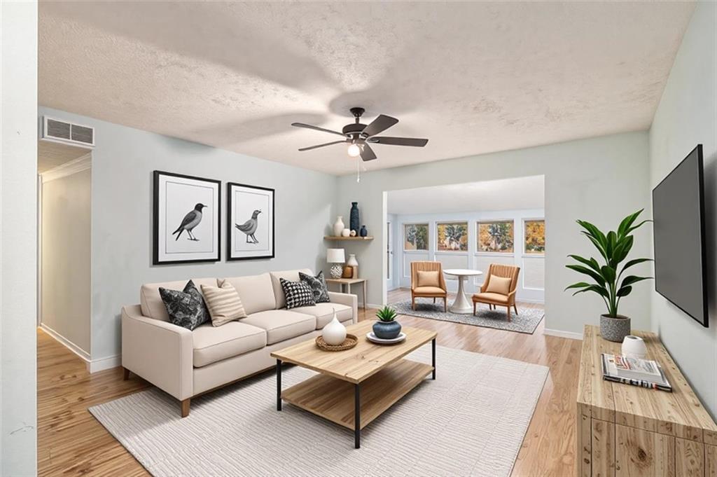 5143 Roswell Road, Unit 8 Atlanta, GA 30342 - Photo 7 of 27 a living room with furniture and a large window