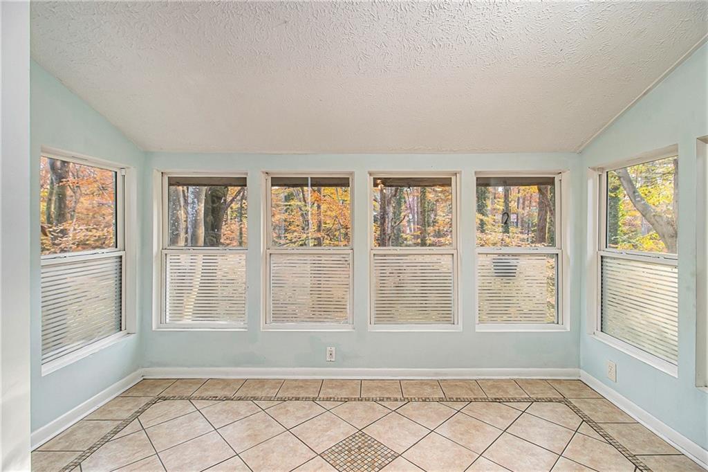 5143 Roswell Road, Unit 8 Atlanta, GA 30342 - Photo 10 of 27 a view of an empty room with a window