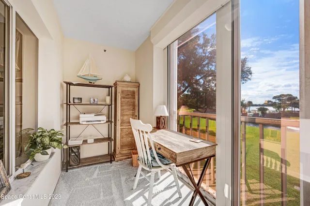 a balcony view with a lot of furniture and a potted plant