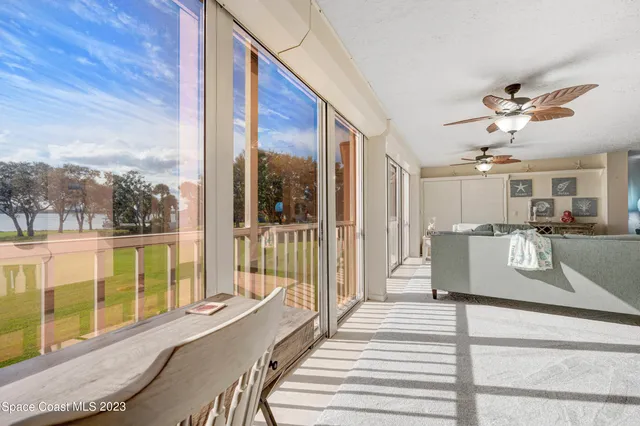 a view of a living room and entry way