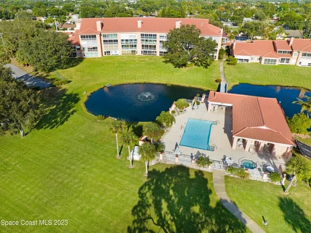 an aerial view of a house with a garden