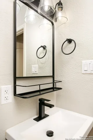 a view of a room with wooden floor and entryway