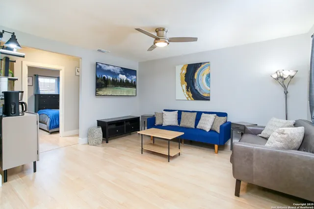 a bedroom with a bed and couch