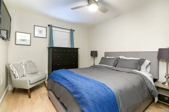 a bedroom with a bed and window