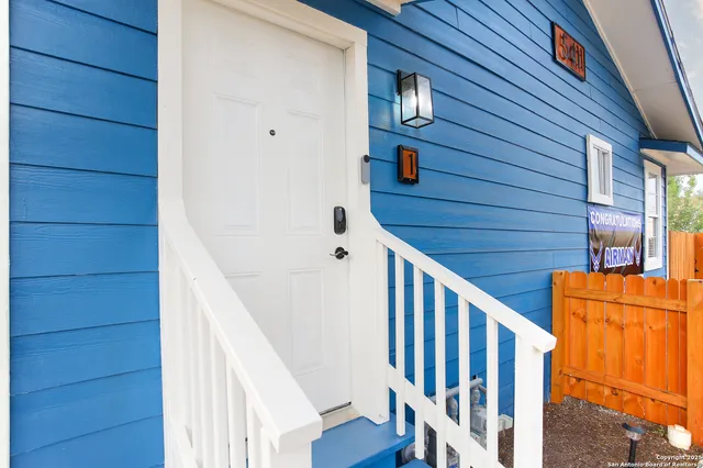 a view of staircase with wooden floor and wall