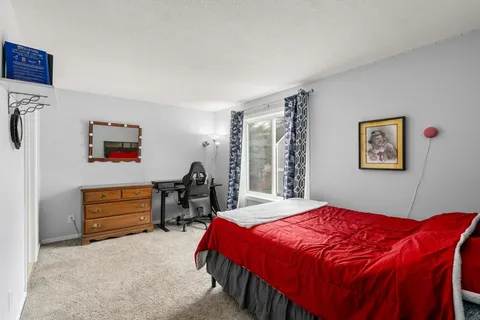 a bedroom with a bed and a cabinets