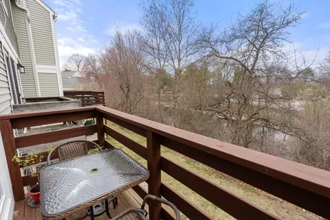 a view of balcony with furniture