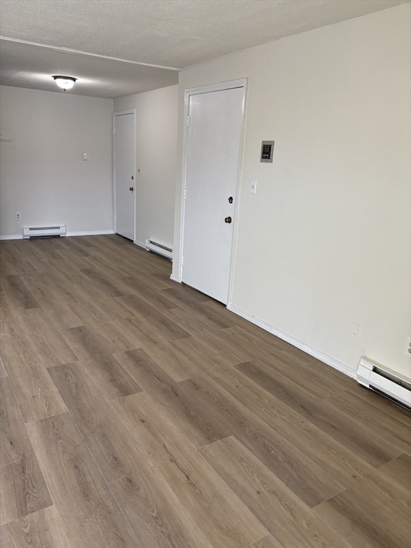 80 Damon Road, Unit 8201 Northampton, MA 01060 - Photo 3 of 19 a view of an empty room with wooden floor