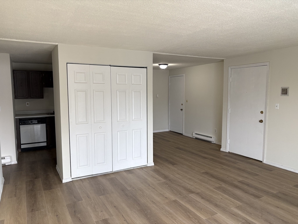 80 Damon Road, Unit 8201 Northampton, MA 01060 - Photo 4 of 19 wooden floor in an empty room
