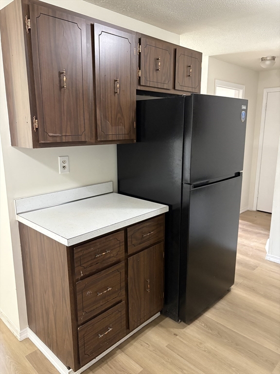 80 Damon Road, Unit 8201 Northampton, MA 01060 - Photo 6 of 19 a kitchen with a refrigerator and a sink