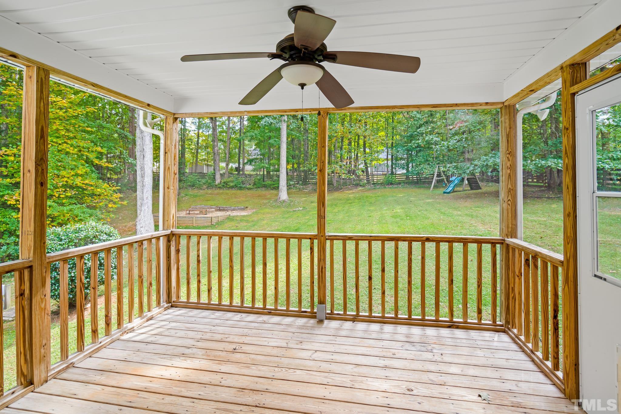 130 Broken Lance Drive Youngsville, NC 27596 - Photo 16 of 32 a view of a balcony with wooden floor and outdoor space