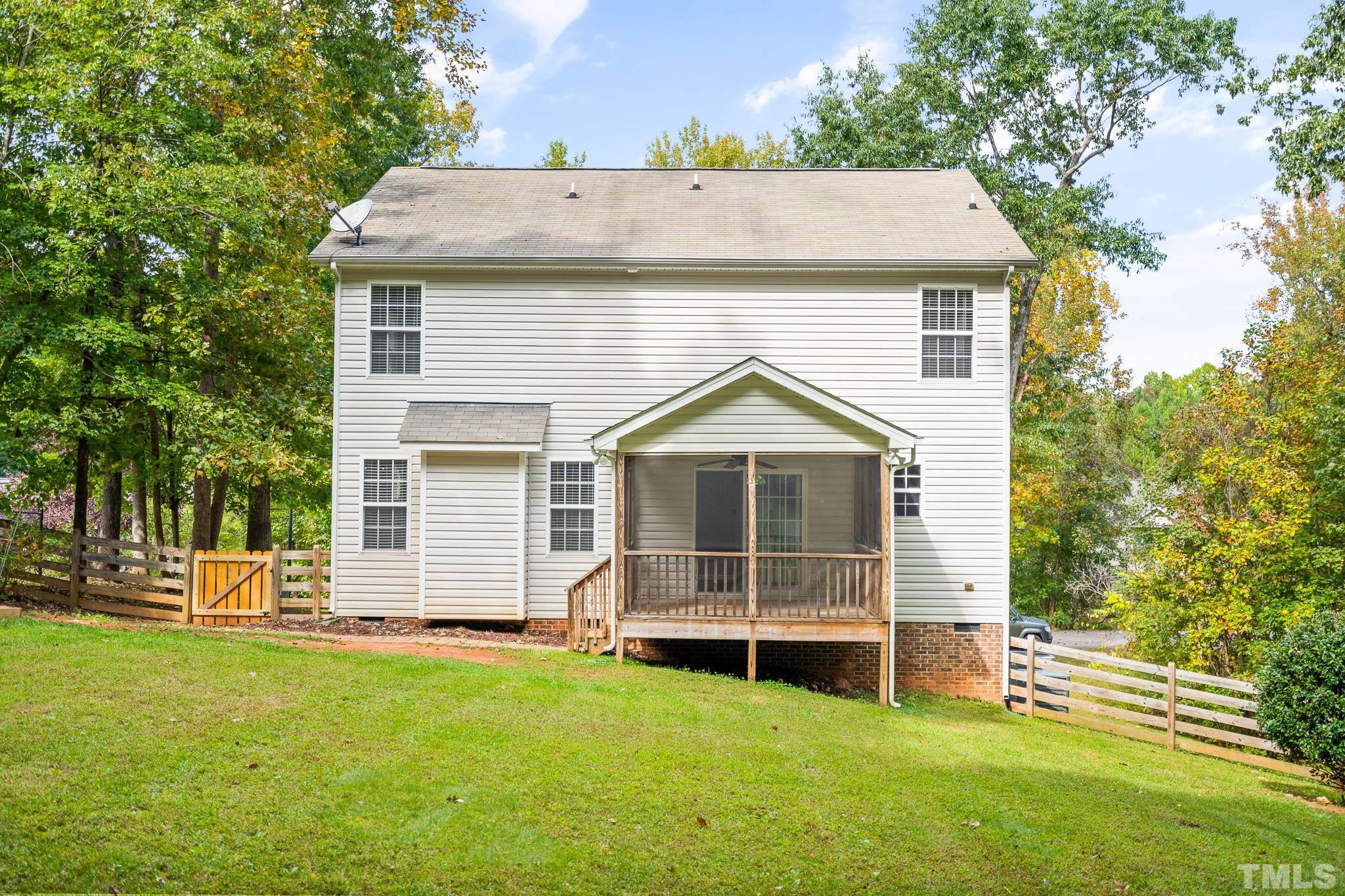 130 Broken Lance Drive Youngsville, NC 27596 - Photo 19 of 32 a view of a house with a backyard