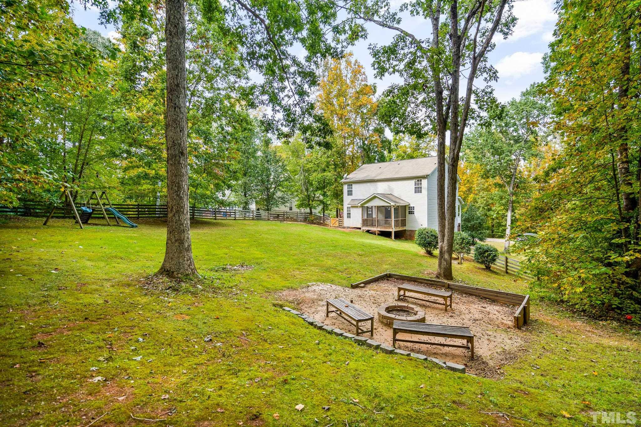 130 Broken Lance Drive Youngsville, NC 27596 - Photo 2 of 32 a view of a patio with a big yard