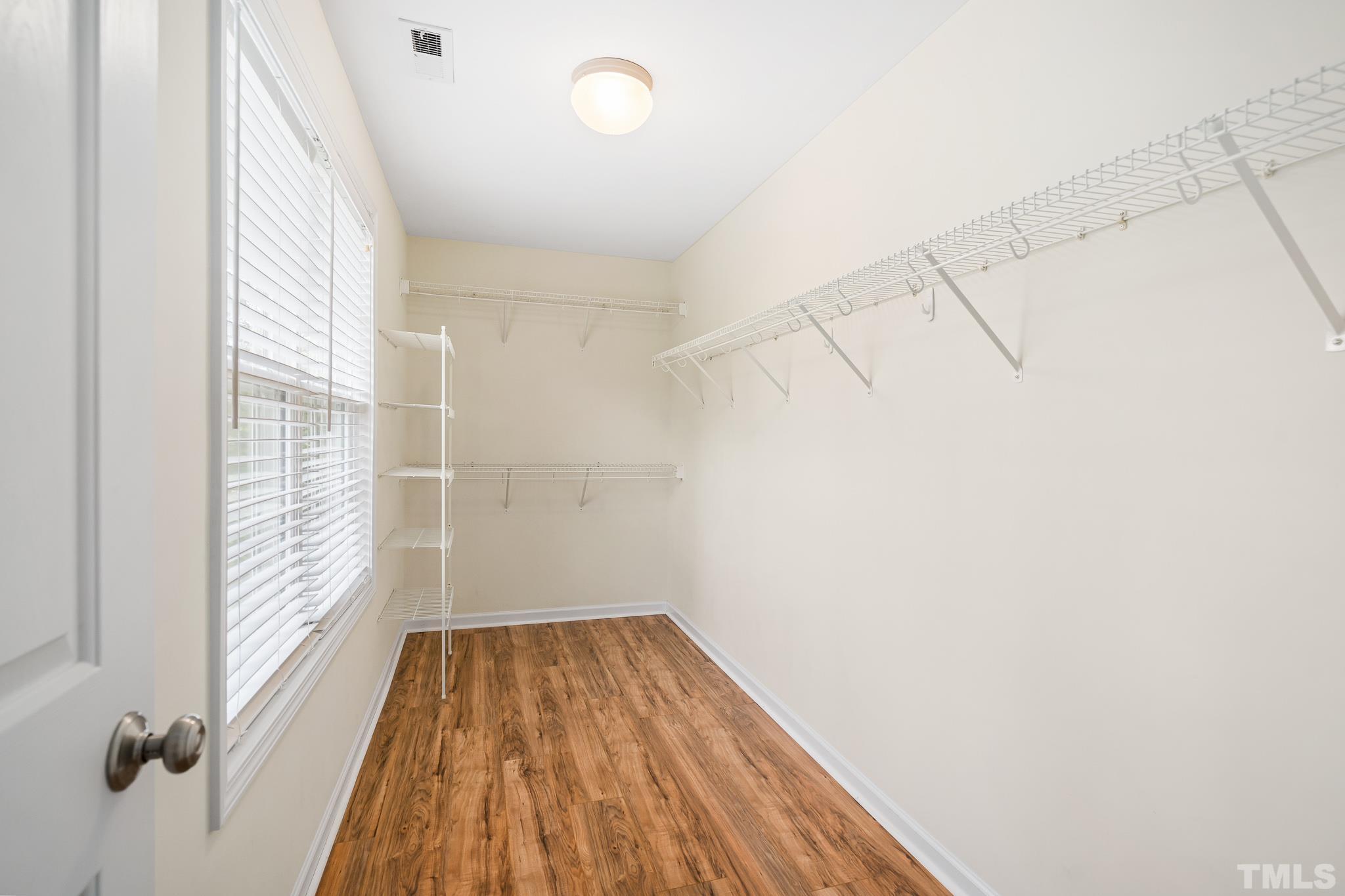130 Broken Lance Drive Youngsville, NC 27596 - Photo 27 of 32 a view of a room with wooden floor and small window