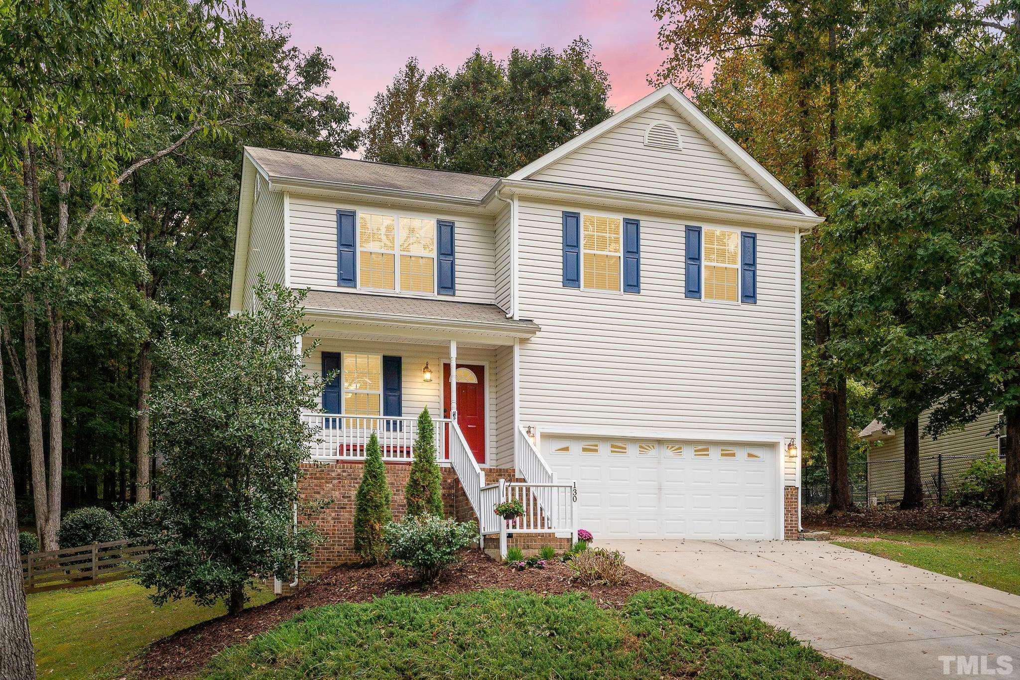 130 Broken Lance Drive Youngsville, NC 27596 - Photo 32 of 32 a front view of a house with a yard and trees