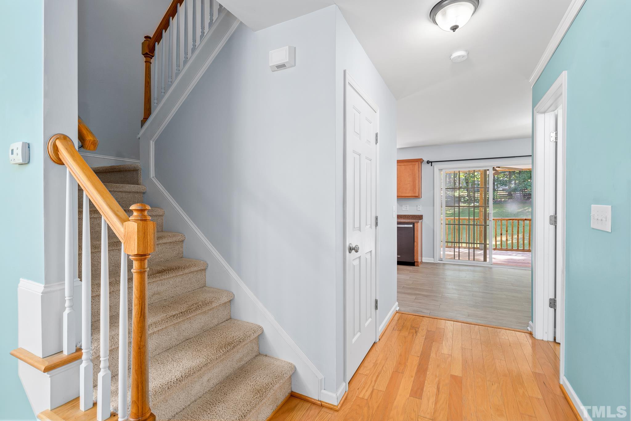 130 Broken Lance Drive Youngsville, NC 27596 - Photo 7 of 32 a view of a hallway with wooden floor and entryway