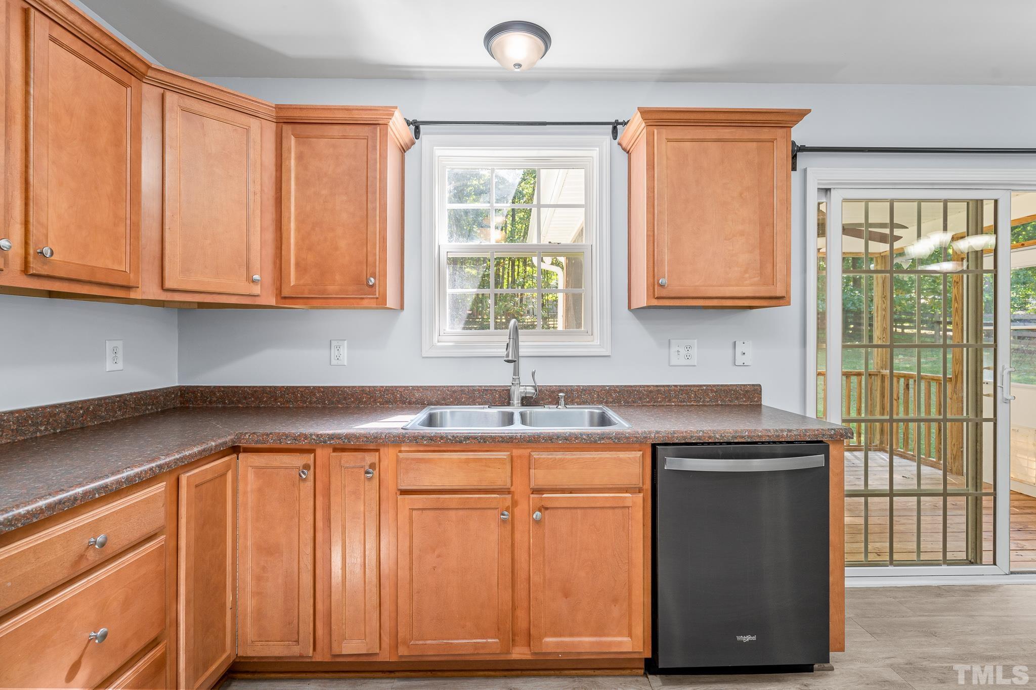 130 Broken Lance Drive Youngsville, NC 27596 - Photo 10 of 32 a kitchen with a sink and cabinets