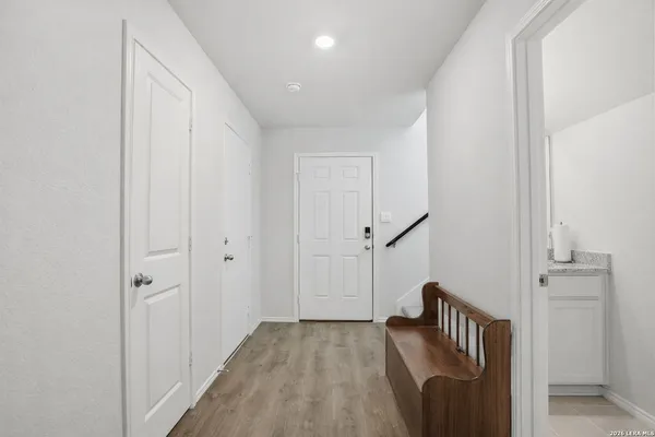 a view of hallway with stairs and a couch