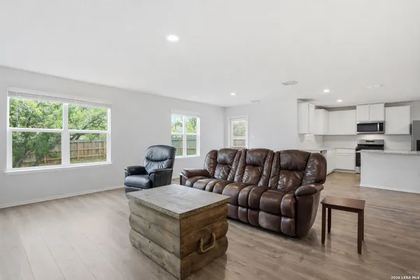 a living room with furniture and a large window