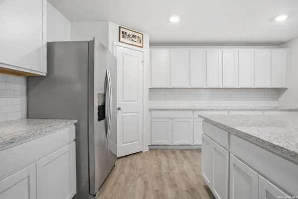 a kitchen with a sink and cabinets