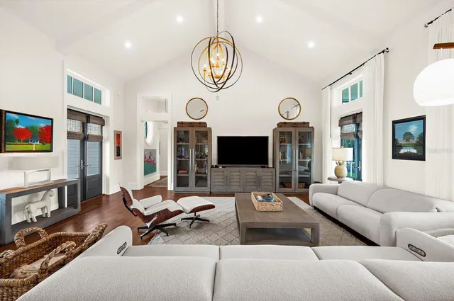 a living room with furniture a fireplace and wooden floor