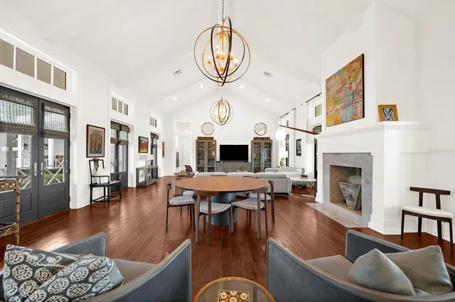 a spacious bathroom with a glass shower door and a window