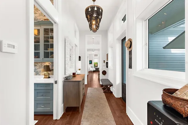 a bathroom with a double vanity sink a mirror and a bathtub