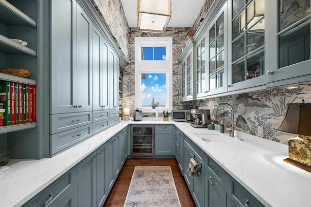 a spacious bedroom with a bed and a flat screen tv