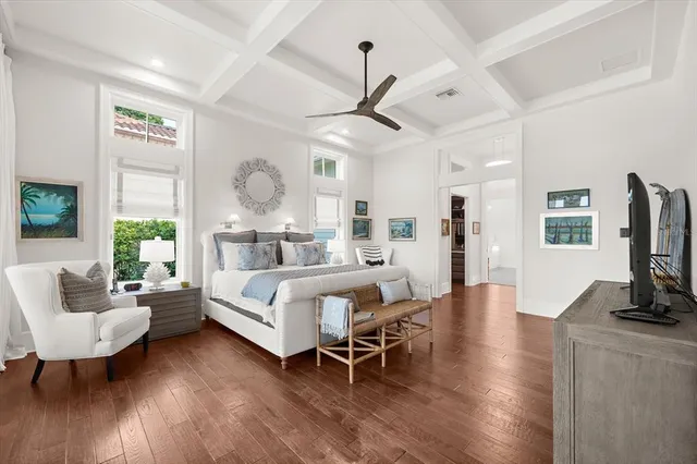 a bedroom with a bed and a table