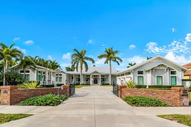 a view of house with a swimming pool outdoor seating