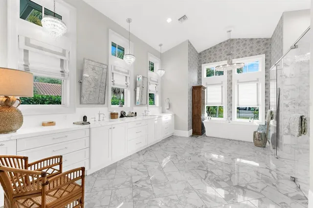 an aerial view of a house with a lake view