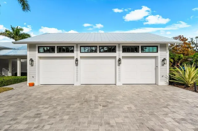 a living room with furniture a fireplace and a large window
