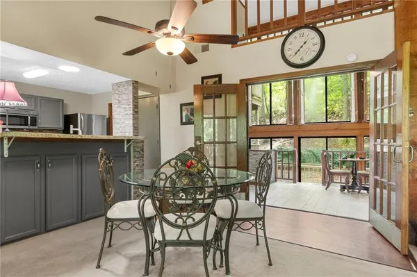 a view of a dining room with furniture window and outside view