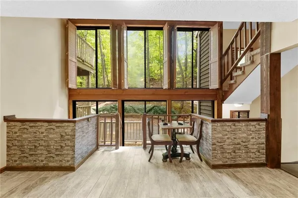 view of hall with wooden floor and furniture