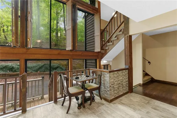 a view of balcony with furniture and garden