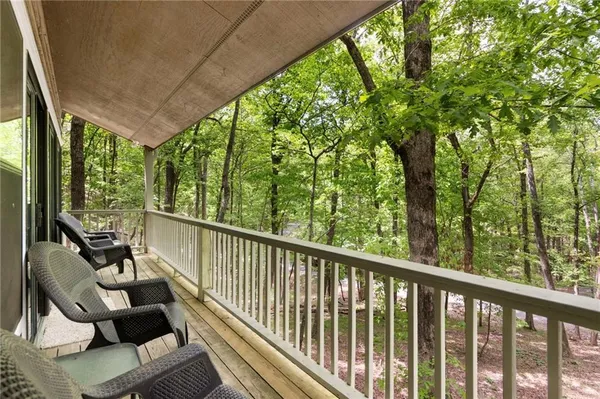 a view of balcony with wooden floor