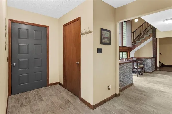 a view of a livingroom with furniture and hardwood floor