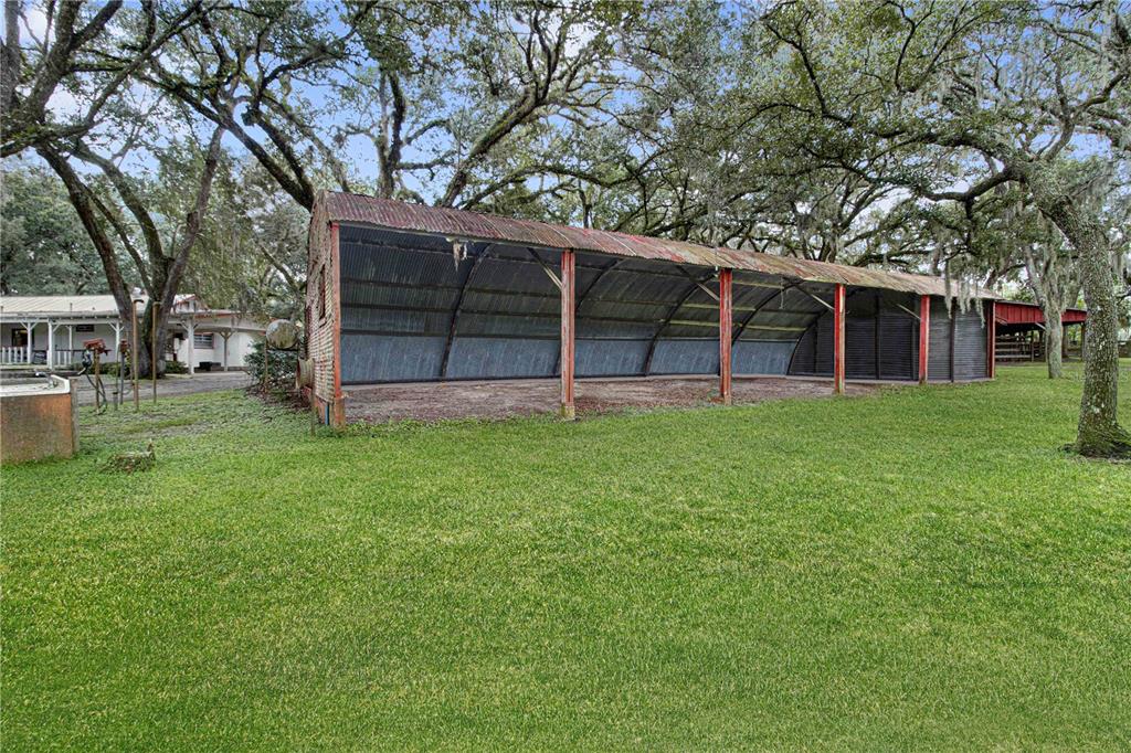 3350 Northeast 125th Terrace Road Silver Springs, FL 34488 - Photo 17 of 47 front view of a house with a yard