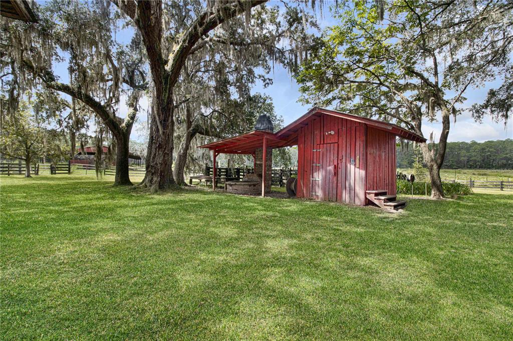 3350 Northeast 125th Terrace Road Silver Springs, FL 34488 - Photo 19 of 47 a view of a house with a yard