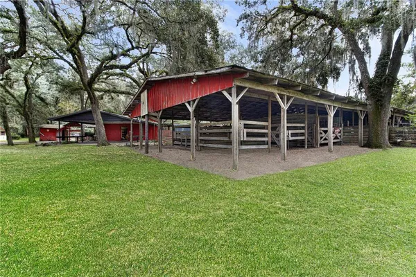 a view of a house with a yard porch and sitting area
