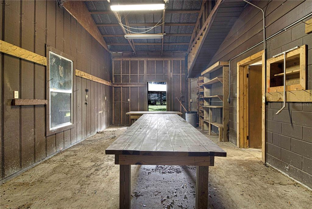 3350 Northeast 125th Terrace Road Silver Springs, FL 34488 - Photo 23 of 47 a view of a hallway with wooden cabinets