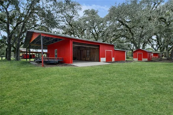 a view of house with backyard